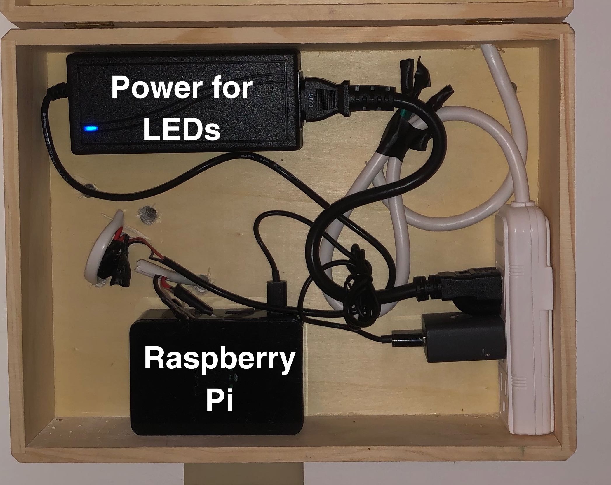 This box is on the opposite side of the wall as the wall installation. It houses the Raspberry Pi and the converter for LED power.